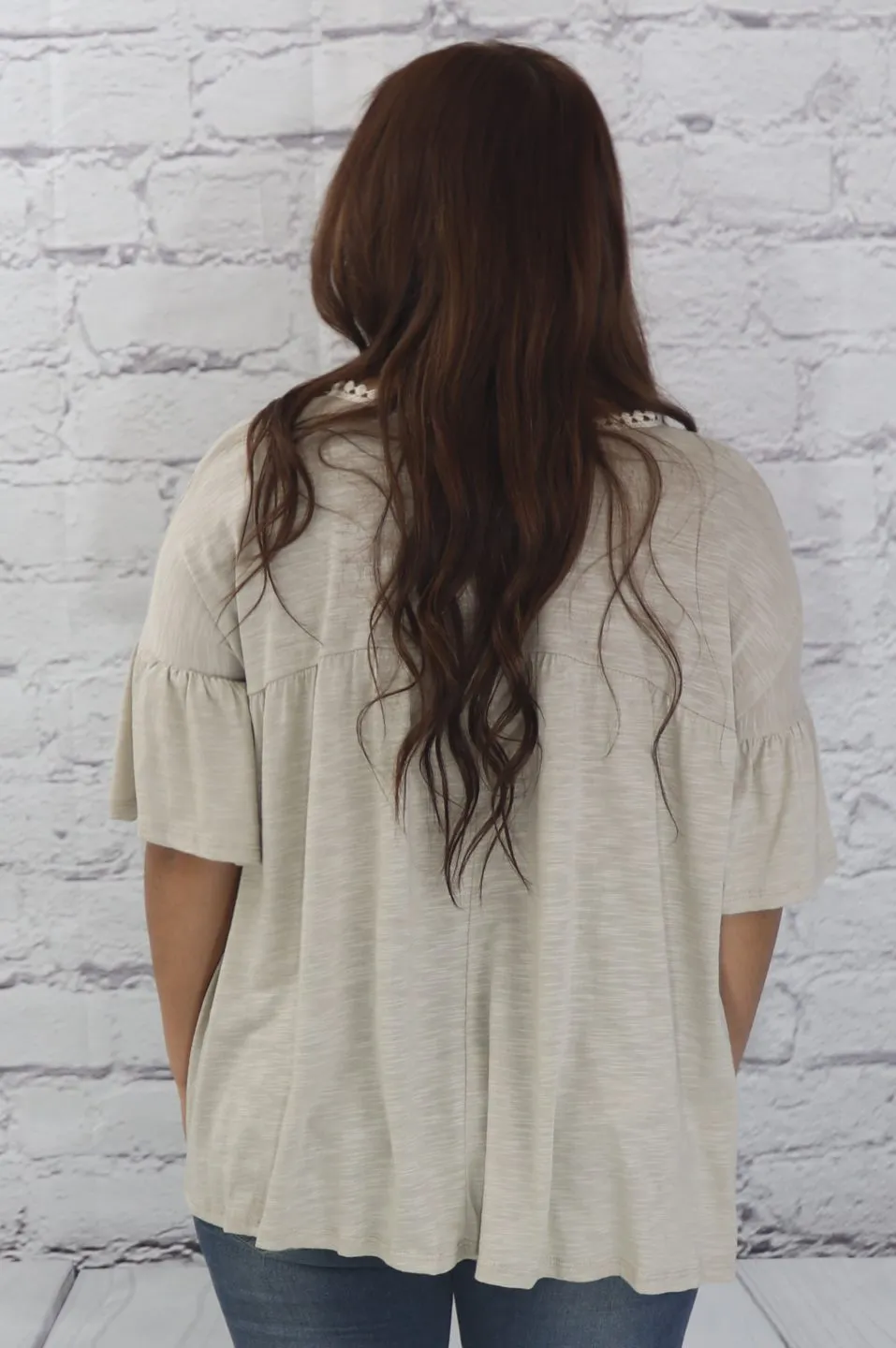 Delicate casual ruffle tunic with lace detail and half dolman sleeve