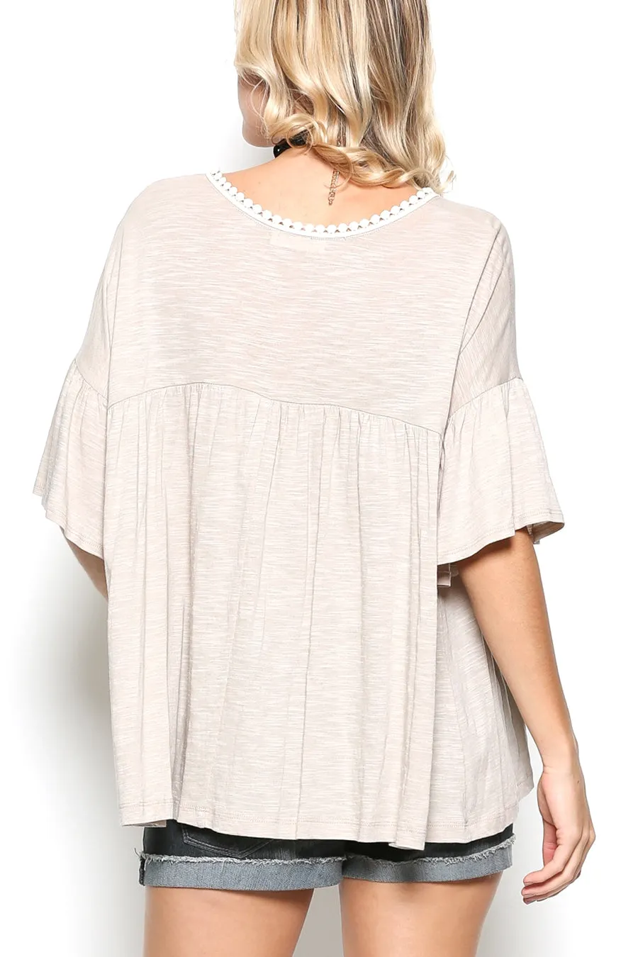 Delicate casual ruffle tunic with lace detail and half dolman sleeve