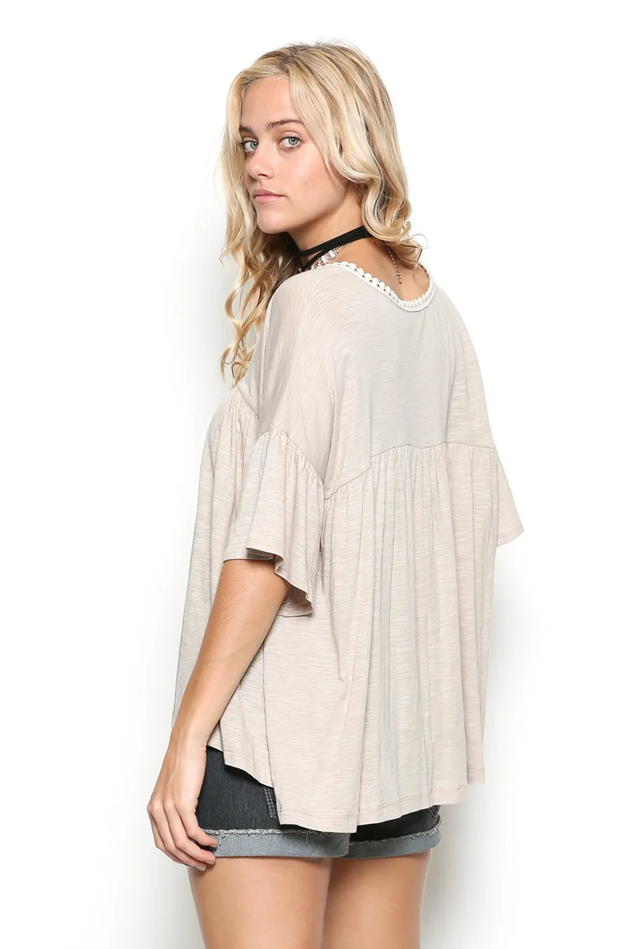 Delicate casual ruffle tunic with lace detail and half dolman sleeve