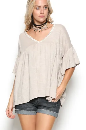 Delicate casual ruffle tunic with lace detail and half dolman sleeve