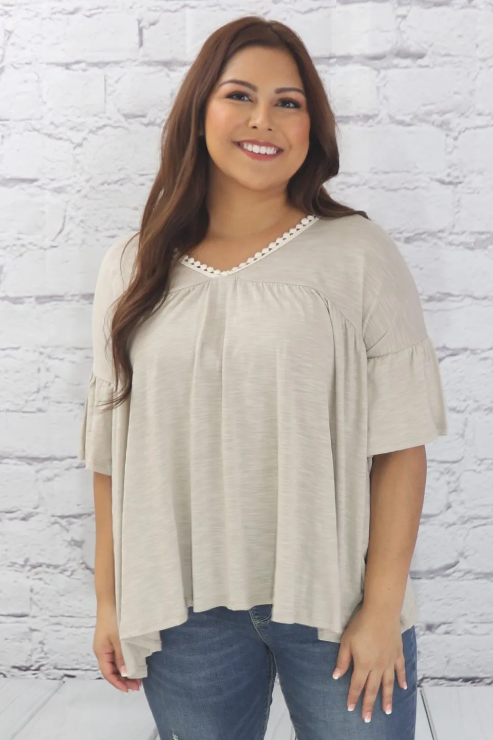 Delicate casual ruffle tunic with lace detail and half dolman sleeve