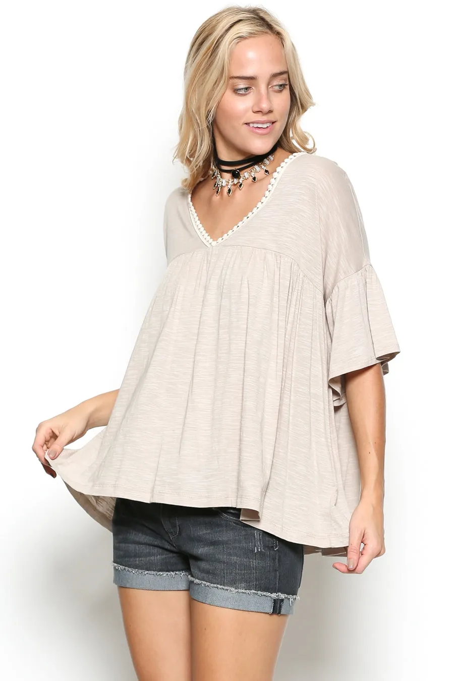 Delicate casual ruffle tunic with lace detail and half dolman sleeve