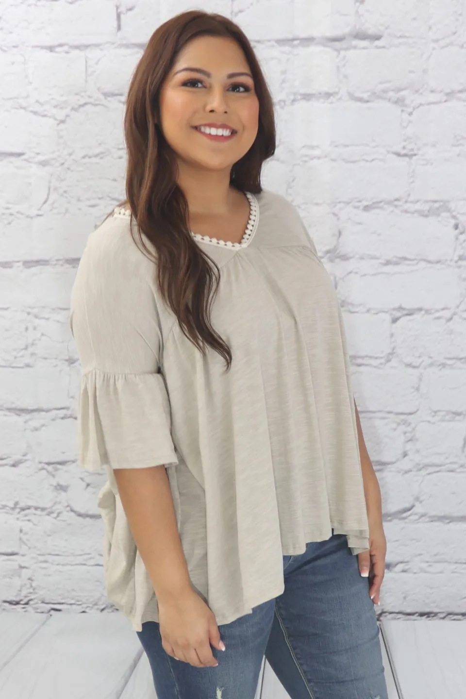 Delicate casual ruffle tunic with lace detail and half dolman sleeve