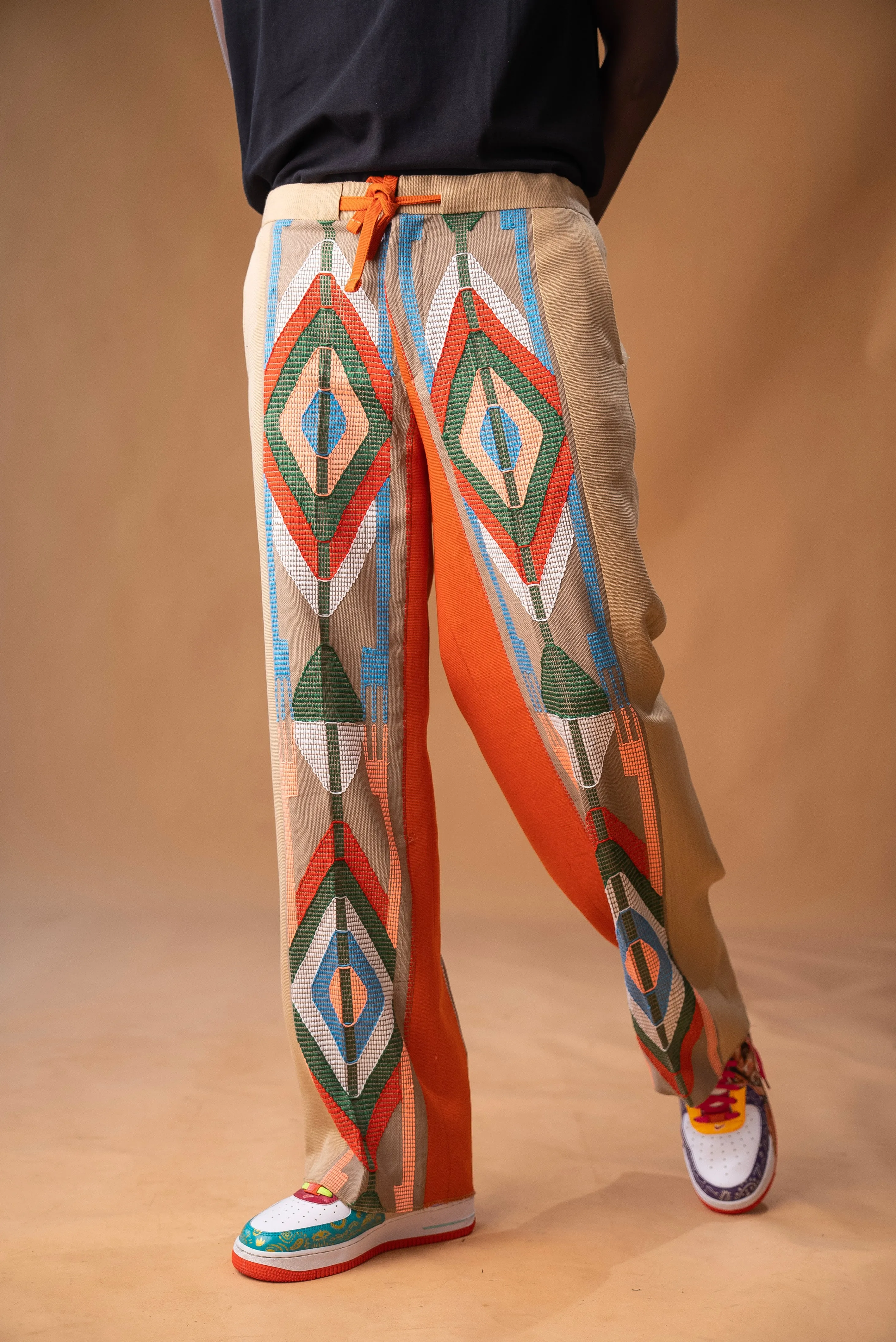 Wide-leg trousers in Aso oke and Akwete